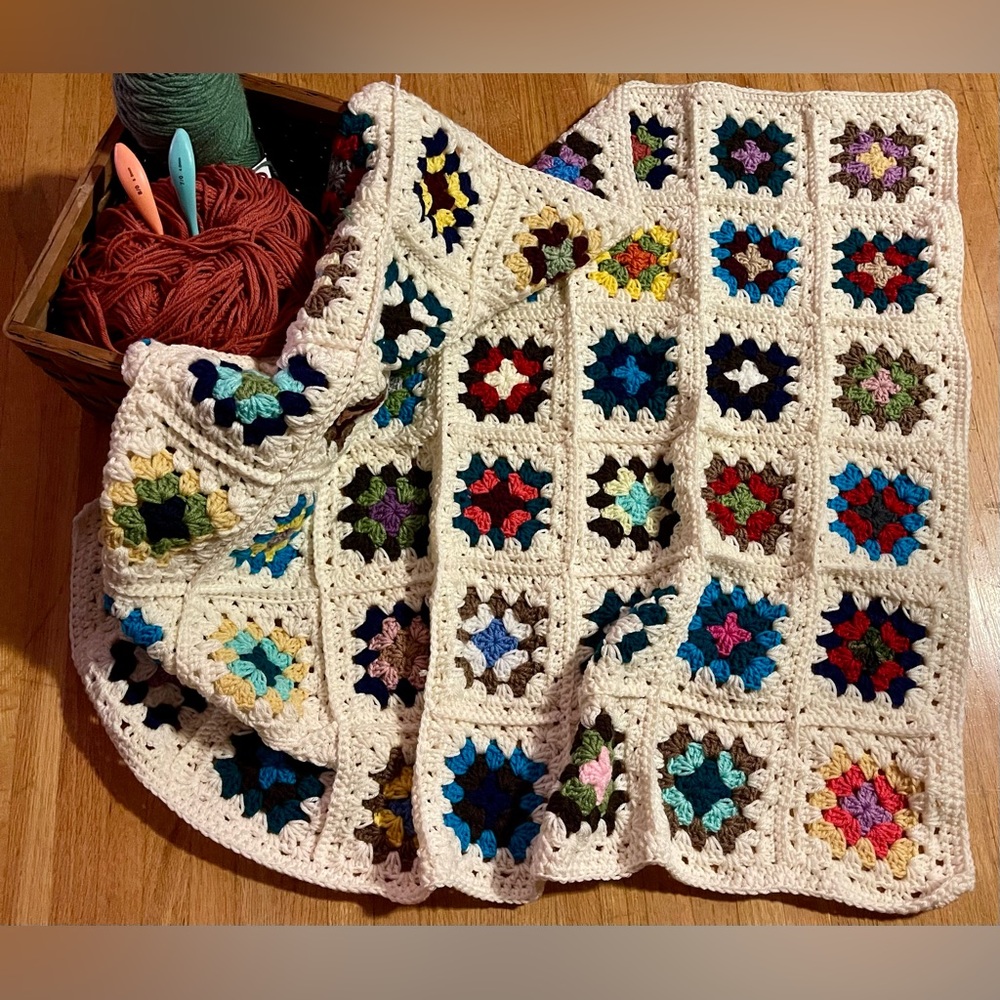 Newly-crafted vintage inspired granny square baby blanket